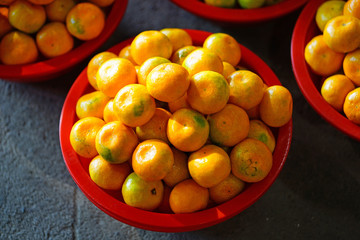 Baskets of Jeju mandarin oranges at a market in South Korea