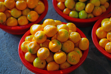 Baskets of Jeju mandarin oranges at a market in South Korea