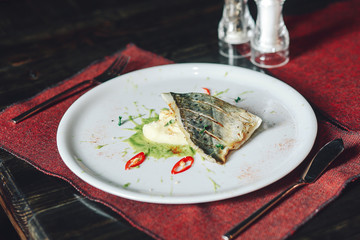 Delicious healthy fish fillet with mashed potatoes and sauce