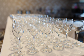 Empty glasses in a row. Empty glasses on a banquet table close-up