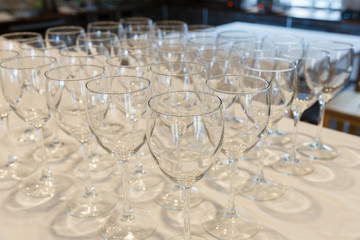 Empty glasses in a row. Empty glasses on a banquet table close-up