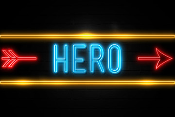 Hero  - fluorescent Neon Sign on brickwall Front view