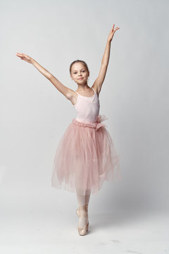 1398907 Little girl on white background, ballerina, dancing