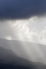 Bad weather before/after the storm over the hills; landscape, background.