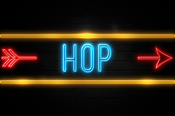 Obraz premium Hop - fluorescent Neon Sign on brickwall Front view
