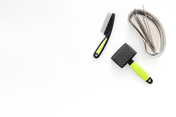 pets cure with tweezers for treatment set on white background top view mock up