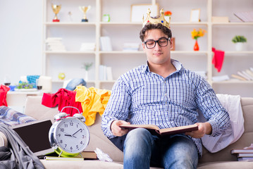 Young man working studying in messy room