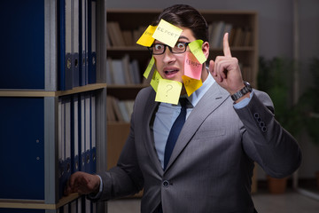 Businessman struggling with conflicting priorities during long h