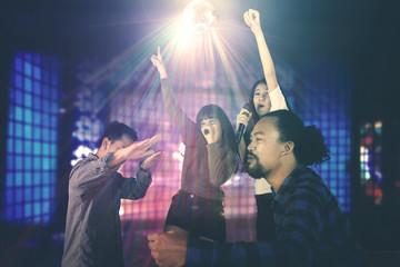 Diversity people dancing in the night club