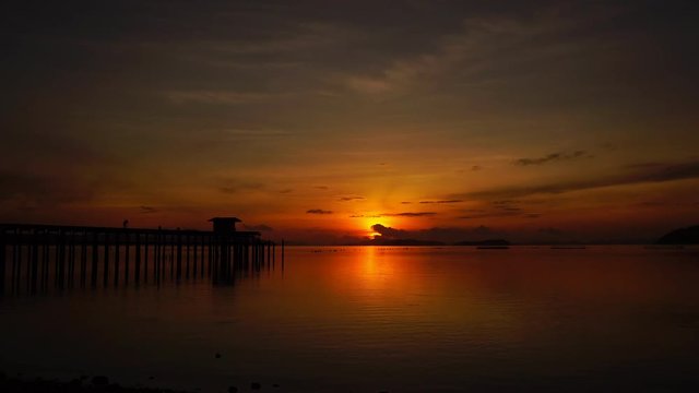 old bridge to the sea in sunrise or sunset at phuket thailand