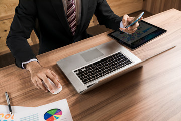 businessman using laptop PC and smartphone.