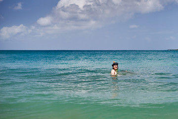 Fototapeta na wymiar 1407872 Woman doing snorkeling at sea