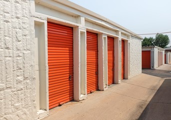 Row of an orange metal doors of a public storage