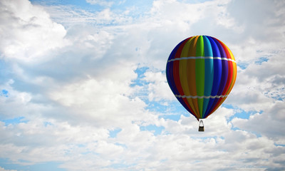 Fototapeta premium Aerostat floating in day sky. Mixed media