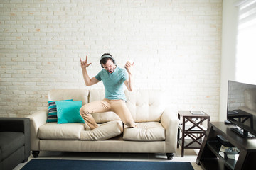 Latin man enjoying rock and roll music