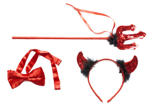 Red devil horns, trident and red bow isolated on white.