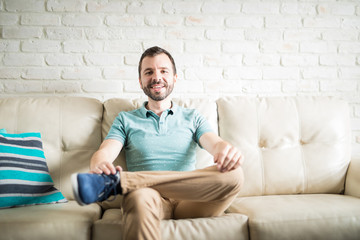Portrait of a man sitting in his living room