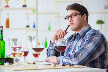 Professional sommelier tasting red wine 