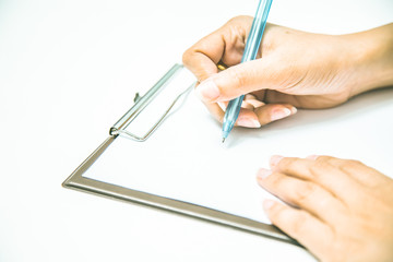 Business women hands working writing on paper at office desk