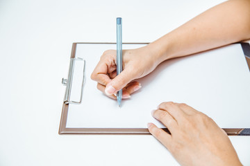 Business women hands working writing on paper at office desk