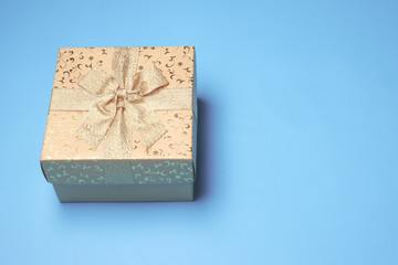 Top view of gift box on blue background. Free space for text