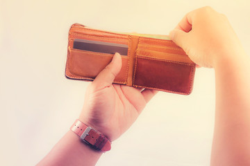 Hand holding wallet