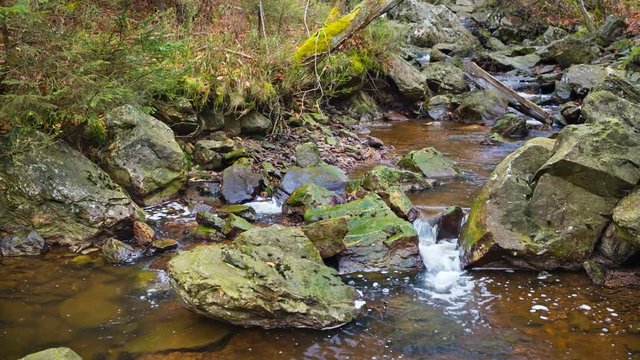 Small waterfalls of the mountain creek Tro Maret in a forest gorge in the Ardennes, Belgium.