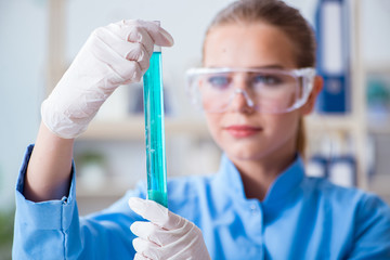 Female scientist researcher conducting an experiment in a labora