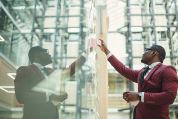 businessman planning concept. glass wall marker and stickers. Startup office.