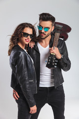 rock and roll woman laughing while leaning on man