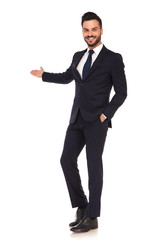 happy modern young business man presenting and smiling