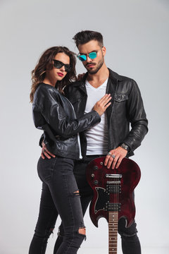 cool rock and roll couple standing embraced