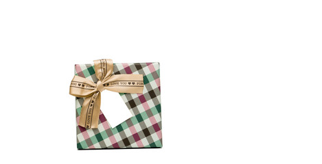 Plaid pattern gift box with beige ribbon bow and blank greeting card isolated on white background with copy space, just add your own text. Use for Christmas and new year festival