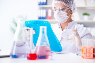 Female scientist researcher conducting an experiment in a labora