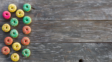 colored donuts on a wooden table