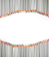Many different color pencils on white background.