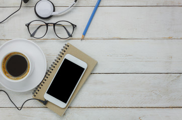 Table top view of technology on business desk background concept.Mix variety items on modern white rustic wood office with copy space.Essential accessory for working.Free area for creative design.