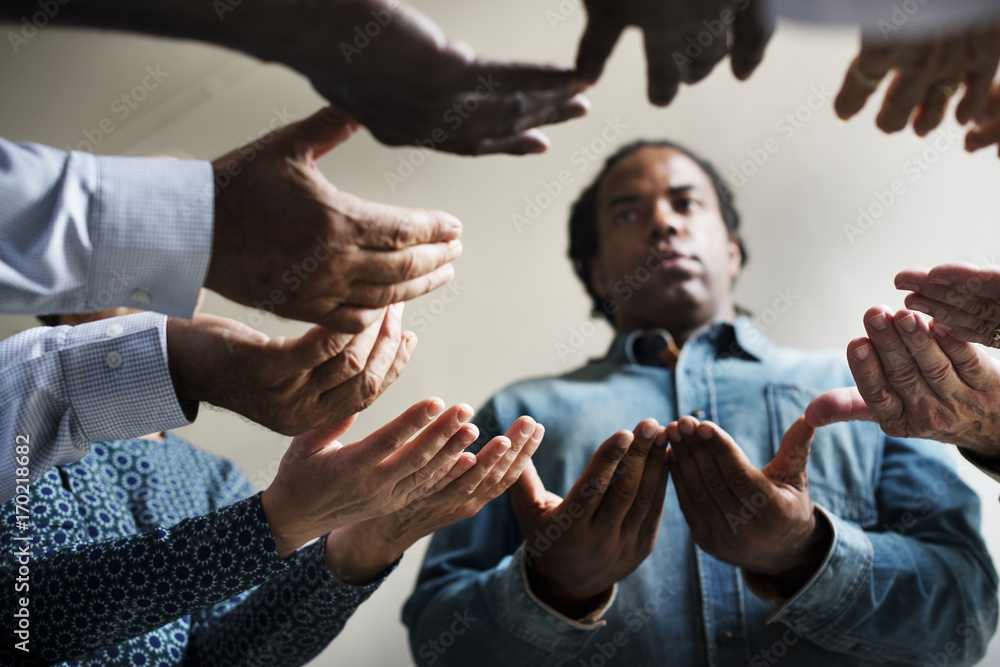 Wall mural Group of christianity people praying hope together