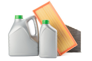 Car oil filters and motor oil can isolated on white