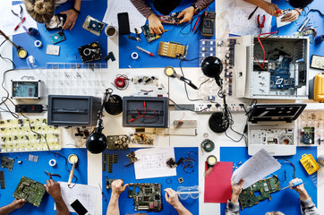 Aerial view of electronics technicians team working