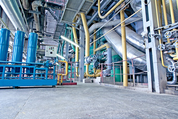 Equipment, cables and piping as found inside of a modern industrial power plant