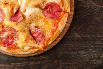 Cut pepperoni pizza with a place for text