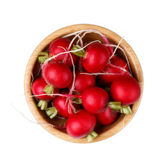 Red radish in wooden bowl isolated on white background.