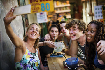 Group of tourist enjoy bucket drinks in Khao San Road Bangkok Thailand walking street