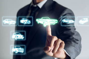 Businessman is shopping online to choose a cars to buy about internet of thing concept, Business...