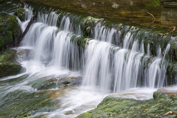 Fototapeta na wymiar Long time exposure of Szklarka waterfall in Karkonosze Mountains, Poland
