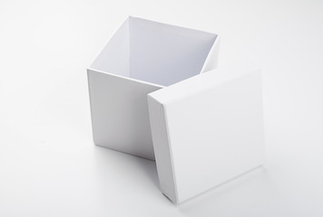 Top view of open white box with lid on white background. Isolated.