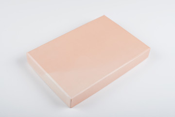 Top view of Lid of a box of orange color on white background. Isolated.