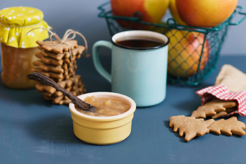 Winter snack with jam, cookies, tea and apples