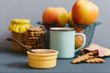 Winter snack with jam, cookies, tea and apples